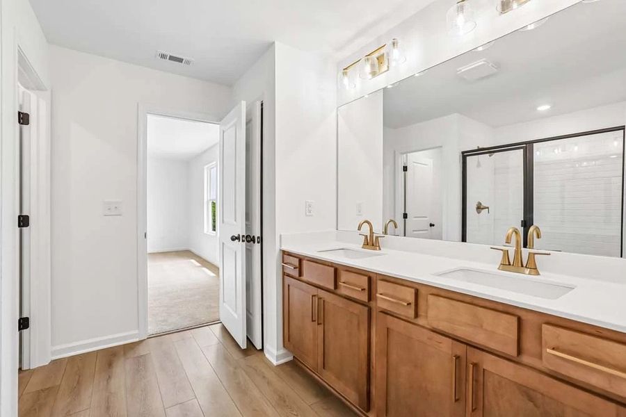 Sample Photo: Primary Bathroom featuring Laguna Collection Finishes Sample Photo: Primary Bathroom featuring Laguna Collection Finishes
