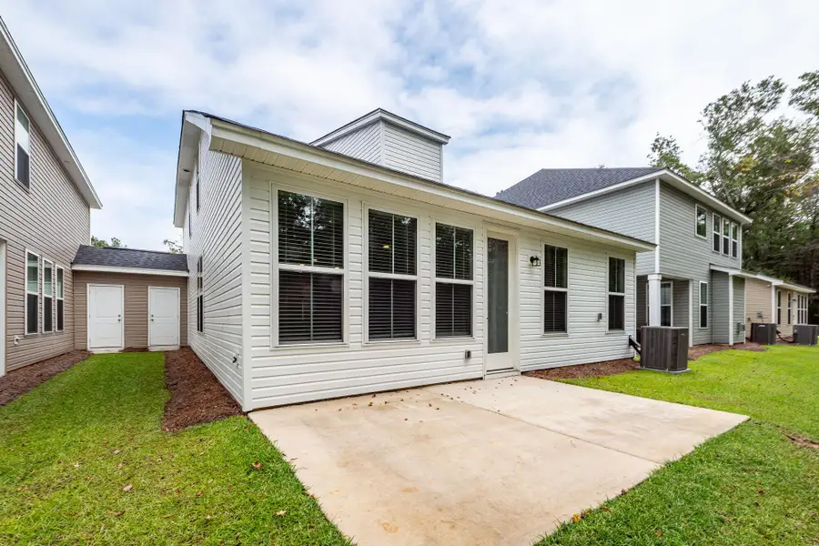 Front exterior of a new home in Hampton Woods, Summerville, SC, highlighting curb appeal (Image 2). Front exterior of a new home in Hampton Woods, Summerville, SC, highlighting curb appeal (Image 2).