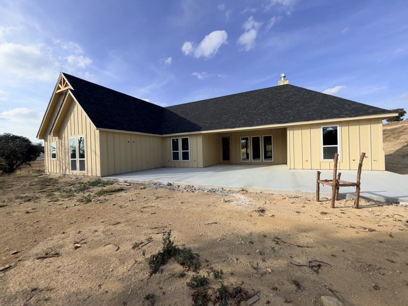 Front exterior of a new home in Saddle Crest Estates, Weatherford, TX, highlighting curb appeal (Image 2).