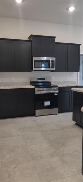 Furnished interior view inside a new home in Sunset Landing, Spring Hill (Image 4).