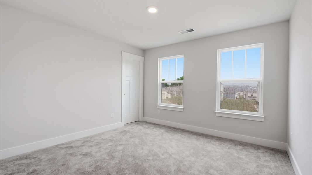 Memorable bedroom space offering plush carpet underfoot and a thoughtfully planned walk-in closet at Woodglen Memorable bedroom space offering plush carpet underfoot and a thoughtfully planned walk-in closet at Woodglen