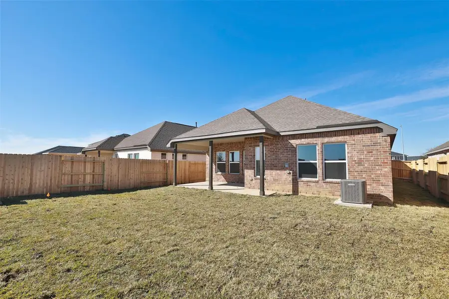 Front exterior of a new home in Cypress Green, Hockley, TX, highlighting curb appeal (Image 2).