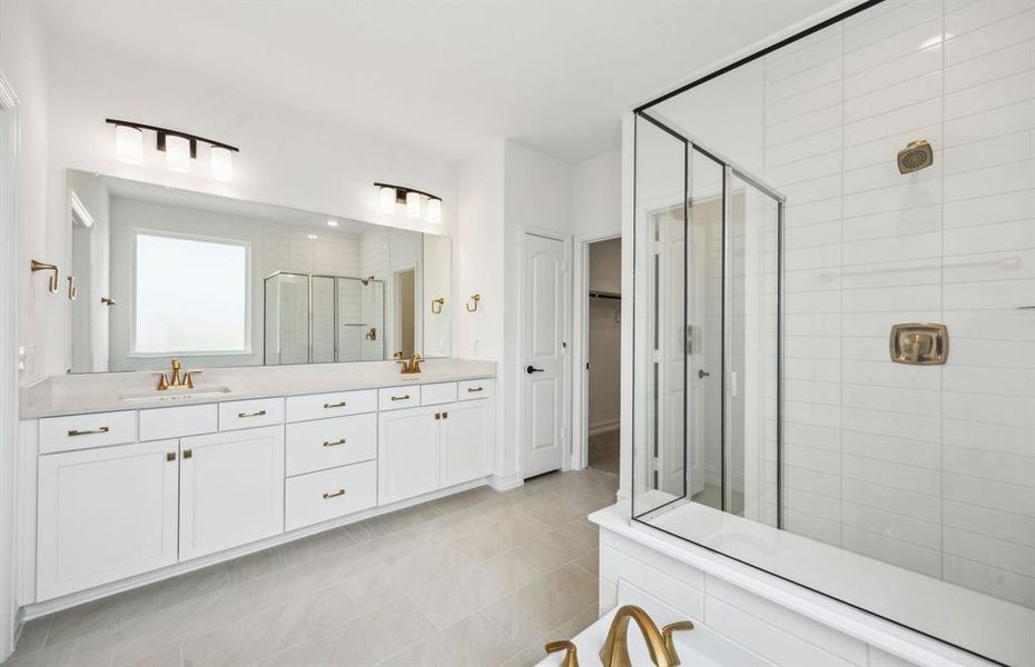 Owner's bathroom with dual vanity *real home pictured