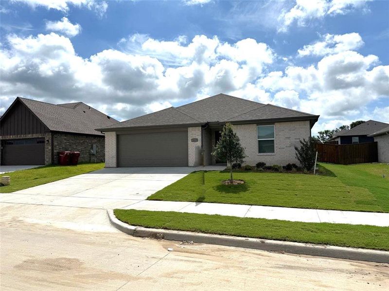 Front exterior of a new home in , Sherman, TX, highlighting curb appeal (Image 15).