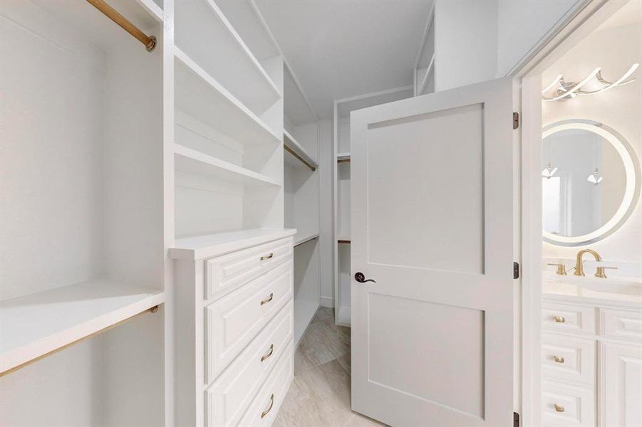 Walk in closet with a sink
