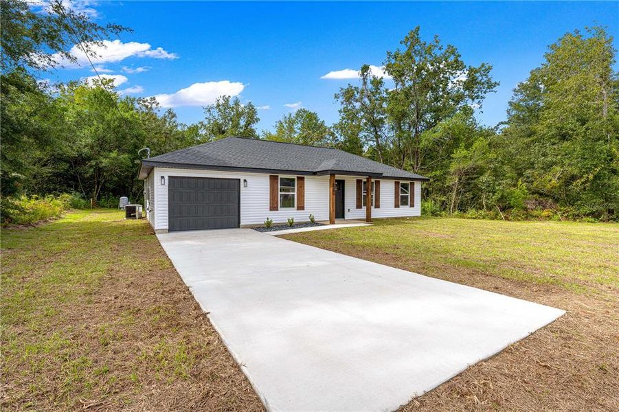 Front exterior of a new home in , Ocala, FL, highlighting curb appeal (Image 19). Front exterior of a new home in , Ocala, FL, highlighting curb appeal (Image 19).