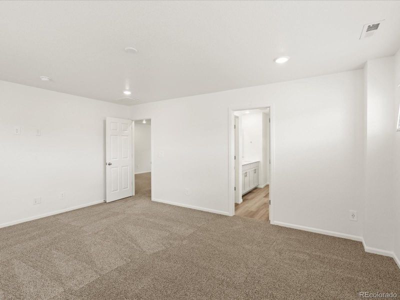 Spacious, unfurnished interior of a new home in Ridgeline Vista: The Flora Collection, Brighton (Image 24).