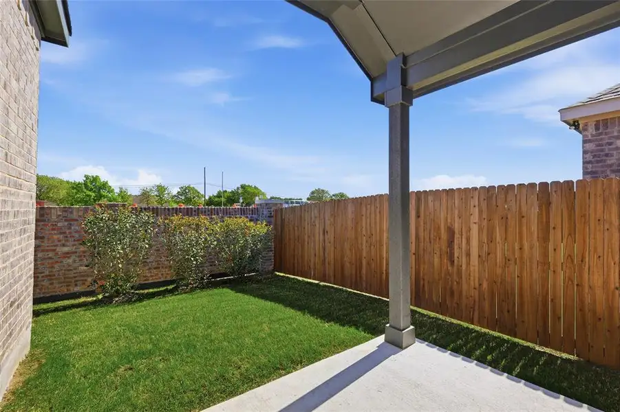 Fenced backyard with a patio Fenced backyard with a patio