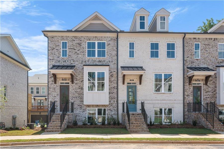 Front exterior of a new home in Evanshire Townhomes, Duluth, GA, highlighting curb appeal (Image 20).