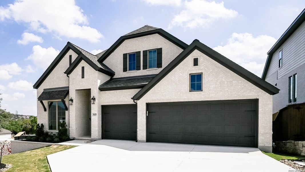 Front exterior of a new home in Johnson Ranch, Bulverde, TX, highlighting curb appeal (Image 2).