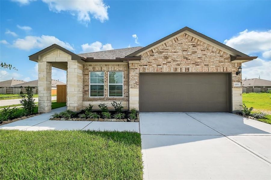Front exterior of a new home in Emberly, Beasley, TX, highlighting curb appeal (Image 5).