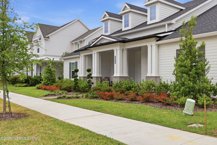 Front exterior of a new home in Seven Pines 70' Rear Entry, Jacksonville, FL, highlighting curb appeal (Image 32).
