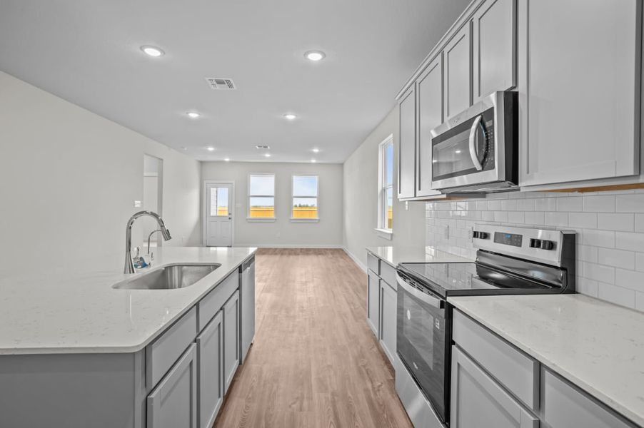 A kitchen with white cabinets. A kitchen with white cabinets.