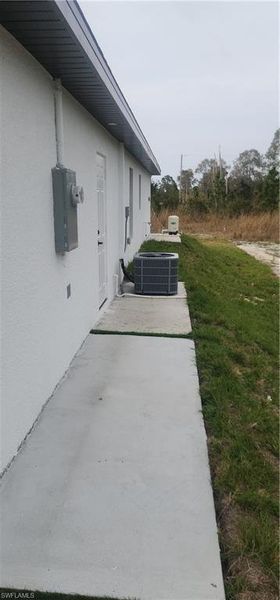 Front exterior of a new home in , Lehigh Acres, FL, highlighting curb appeal (Image 2).