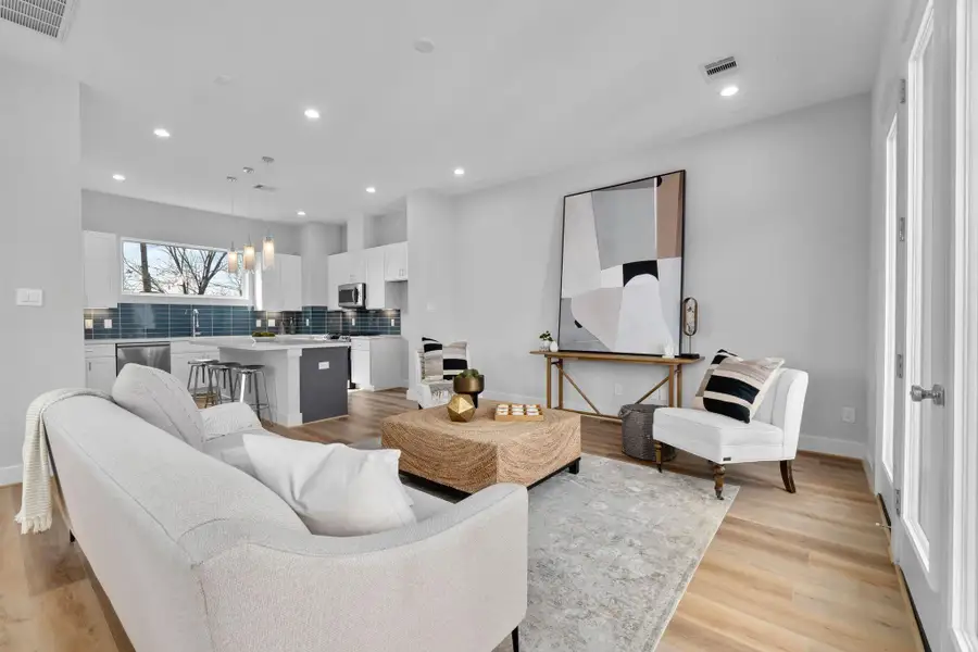 Well-designed living area with an open layout that connects effortlessly to the kitchen, offering both functionality and flexibility.