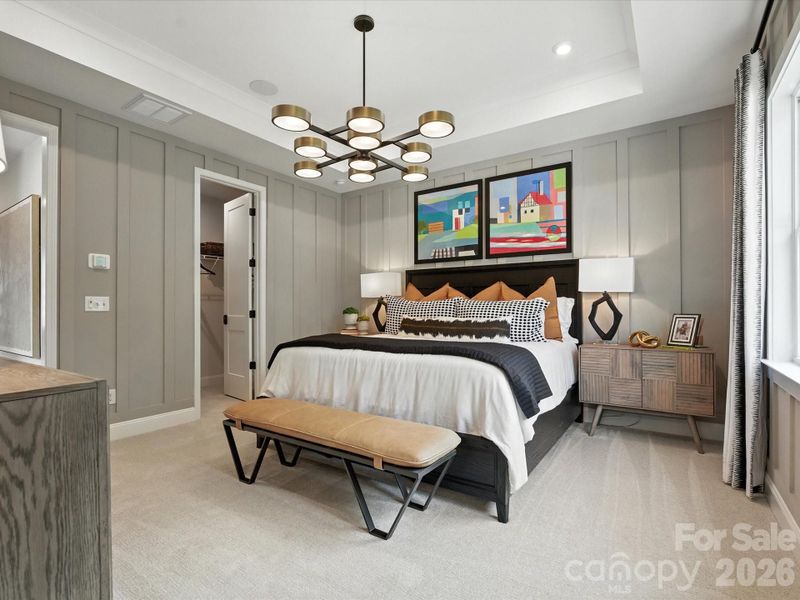 Primary bedroom with tray ceilings Primary bedroom with tray ceilings