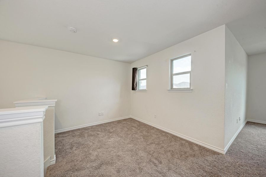 A versatile open loft area provides additional living space.