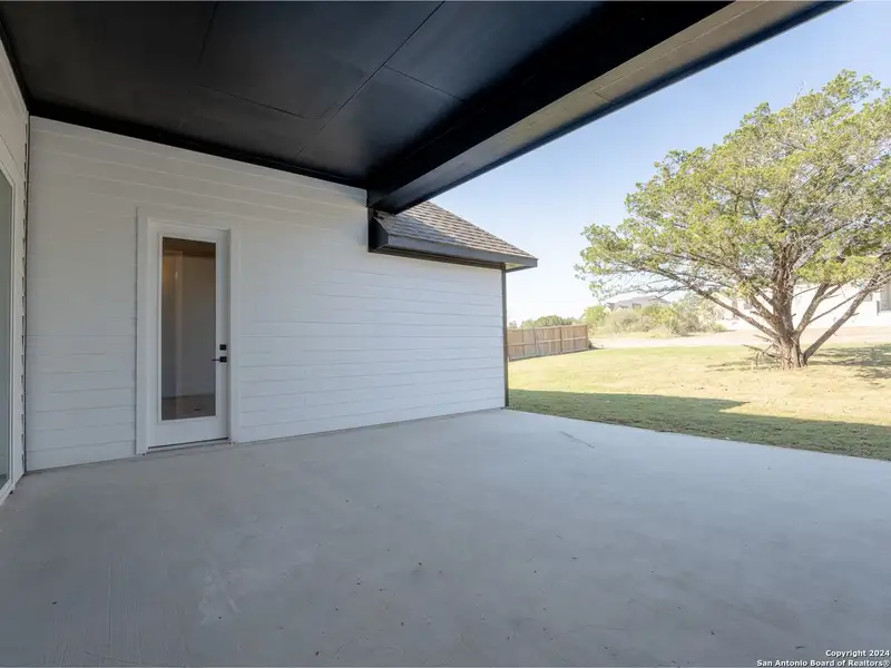Exterior details and patio area of a home in Potranco Oaks, Castroville (Image 2). Exterior details and patio area of a home in Potranco Oaks, Castroville (Image 2).