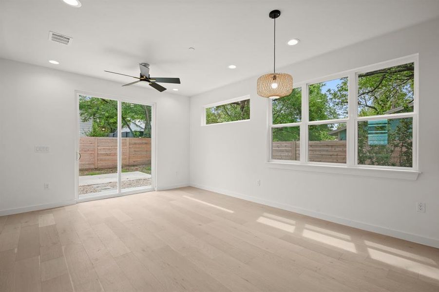 Unfurnished room with ceiling fan, light wood-style flooring, and recessed lighting