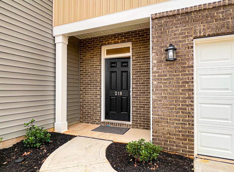 Front exterior of a new home in Bellevue Townhomes, Greenville, SC, highlighting curb appeal (Image 2).
