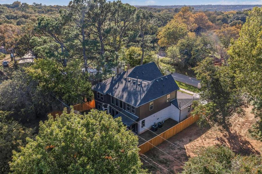 View from above of property with a heavily wooded area