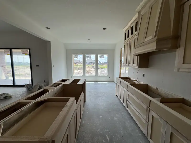 In-progress construction of a new home in Coyote Crossing, Godley, TX (Image 6).