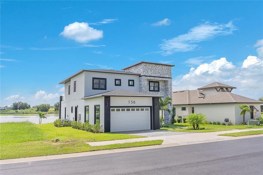 Front exterior of a new home in , Lake Alfred, FL, highlighting curb appeal (Image 24).