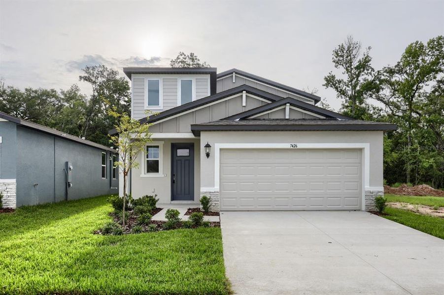 Front exterior of a new home in Leyland Preserve - Premier Series, Brooksville, FL, highlighting curb appeal (Image 1). Front exterior of a new home in Leyland Preserve - Premier Series, Brooksville, FL, highlighting curb appeal (Image 1).