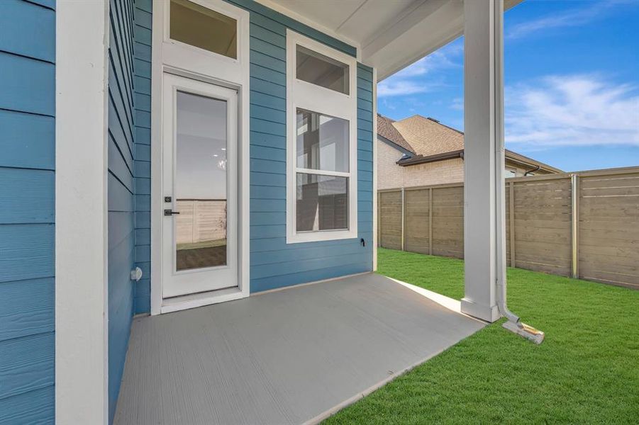 Exterior details and patio area of a home in Treeline, Justin (Image 2).