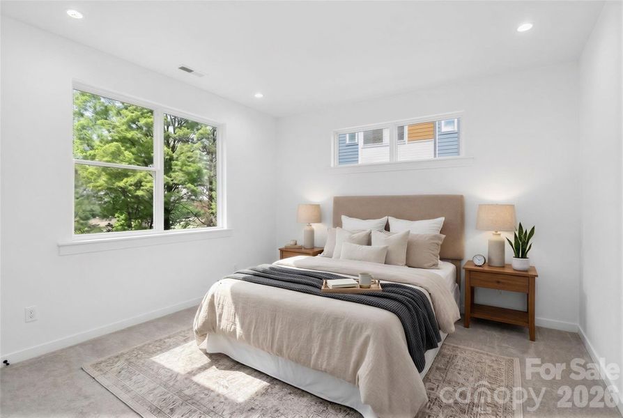 Upper level bedroom suite virtually staged.