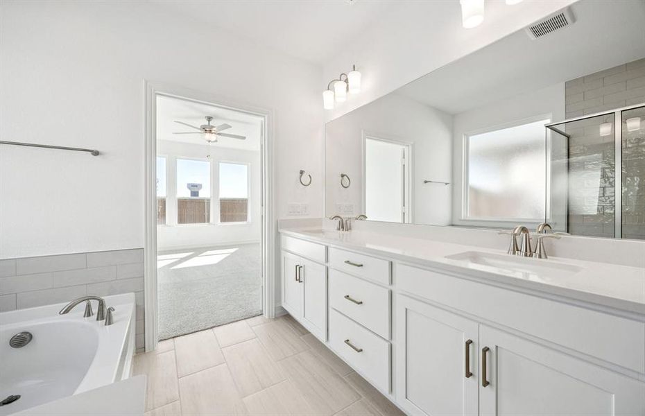 Spacious owner's bath with ample cabinet storage Spacious owner's bath with ample cabinet storage