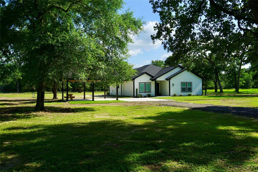 Front exterior of a new home in , Hempstead, TX, highlighting curb appeal (Image 23).