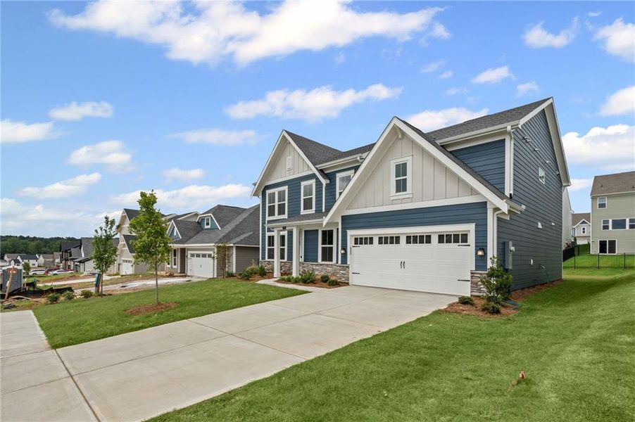 Front exterior of a new home in Twin Lakes, Hoschton, GA, highlighting curb appeal (Image 2).