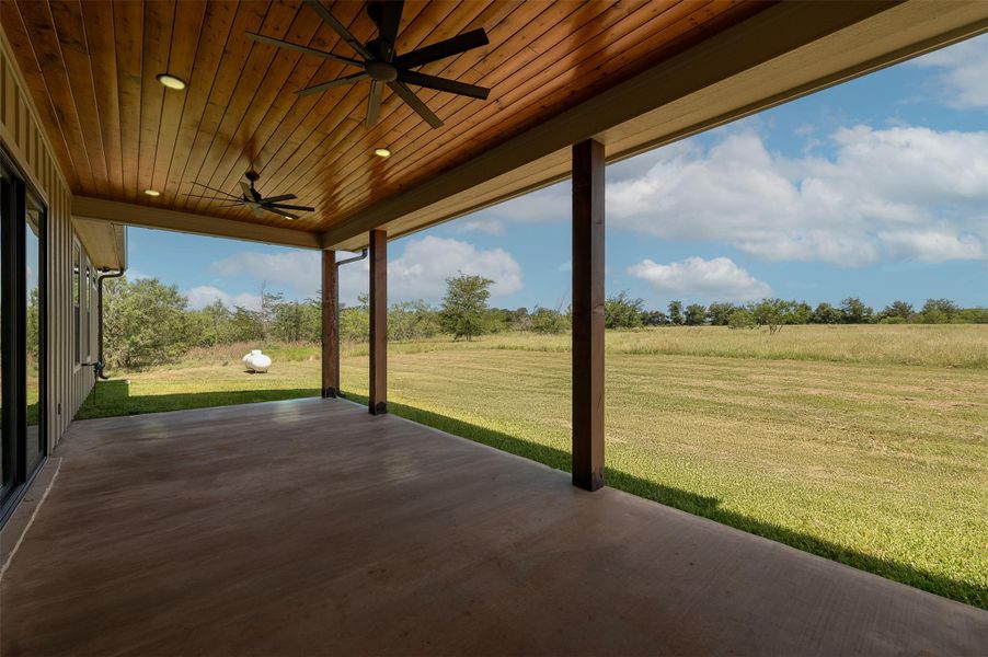 View of patio featuring ceiling fan