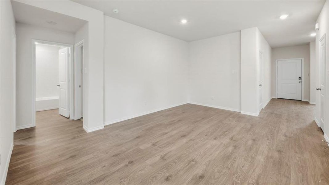 Spare room with light wood-style floors and recessed lighting Spare room with light wood-style floors and recessed lighting