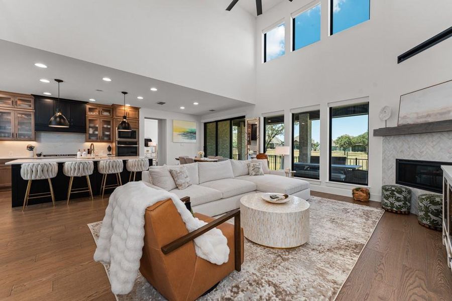 An airy living space with soaring ceilings and expansive windows offers abundant natural light and seamless indoor-outdoor living. An airy living space with soaring ceilings and expansive windows offers abundant natural light and seamless indoor-outdoor living.