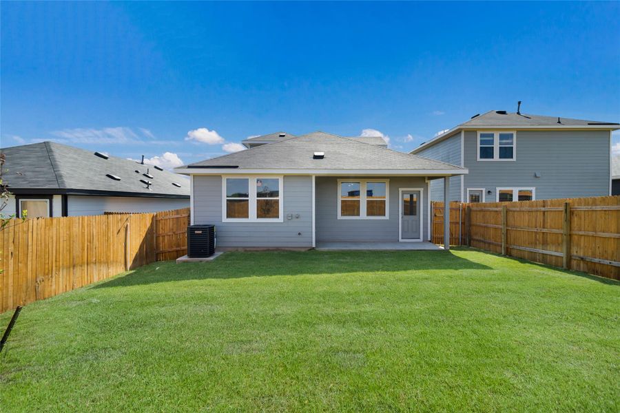 Front exterior of a new home in Marigold, Uhland, TX, highlighting curb appeal (Image 15). Front exterior of a new home in Marigold, Uhland, TX, highlighting curb appeal (Image 15).