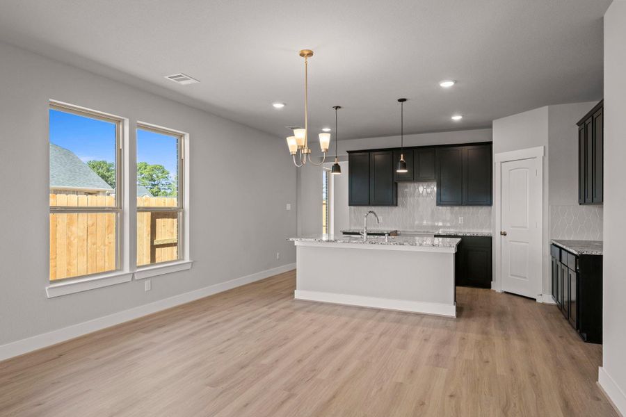 Natural light pours in through large windows, creating a bright and airy atmosphere that makes cooking feel less like a chore and more like a delightful experience. Natural light pours in through large windows, creating a bright and airy atmosphere that makes cooking feel less like a chore and more like a delightful experience.