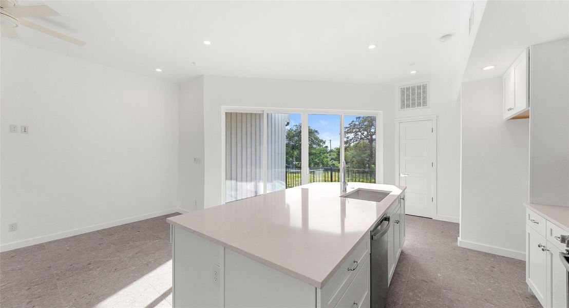 An open living and dining level wrapped in floor-to-ceiling glass, where natural light and easy flow make entertaining and relaxing equally effortless. Model No. 104 Shown.