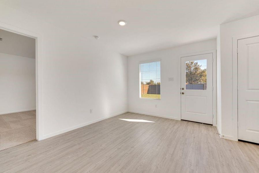 Foyer entrance with light hardwood / wood-style flooring