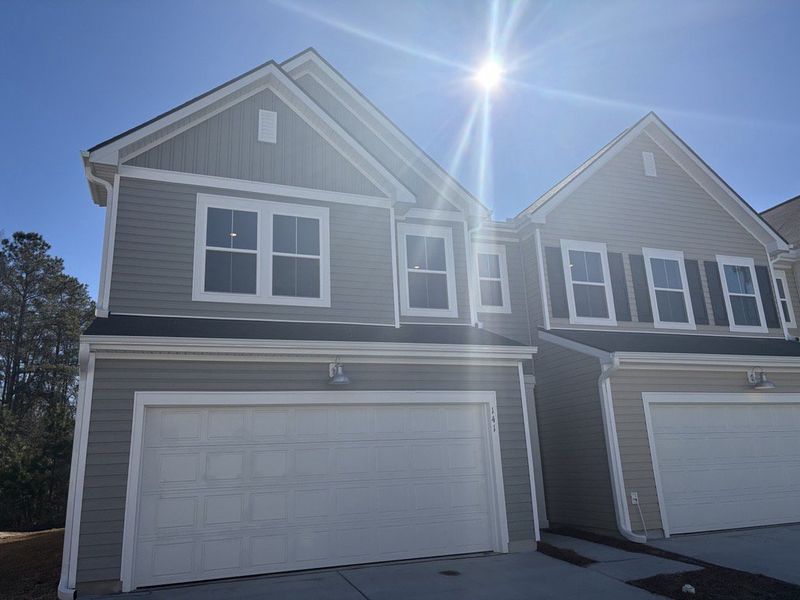 Front exterior of a new home in Dawson Pointe, Summerville, SC, highlighting curb appeal (Image 1). Front exterior of a new home in Dawson Pointe, Summerville, SC, highlighting curb appeal (Image 1).