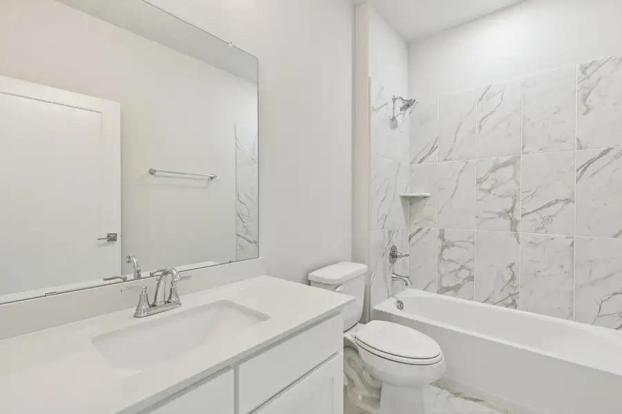 Bathroom in the Stanley II home plan by Trophy Signature Homes – REPRESENTATIVE PHOTO