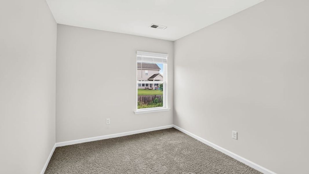 Spacious, unfurnished interior of a new home in Tanglewood Townes, Greenville (Image 28).