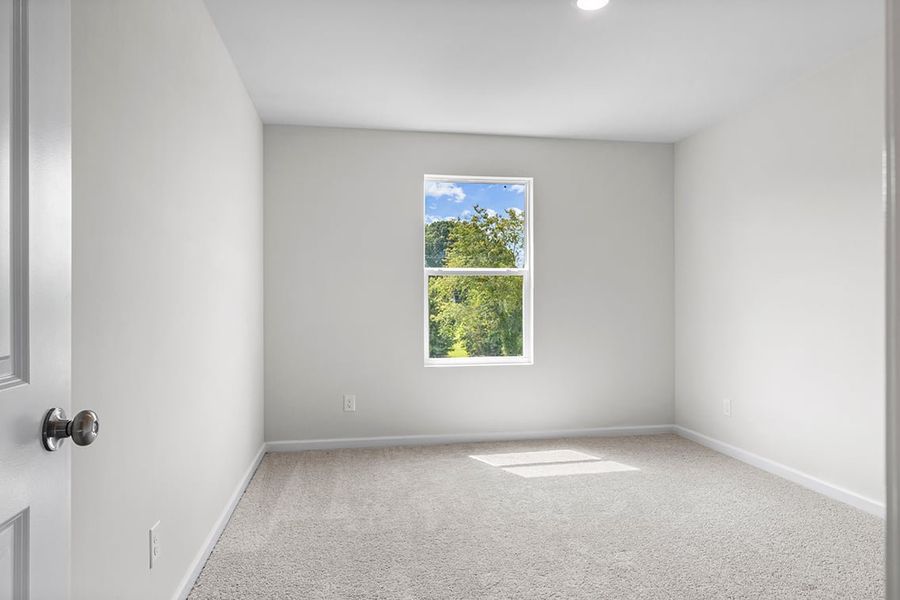 A room with a window and a door.