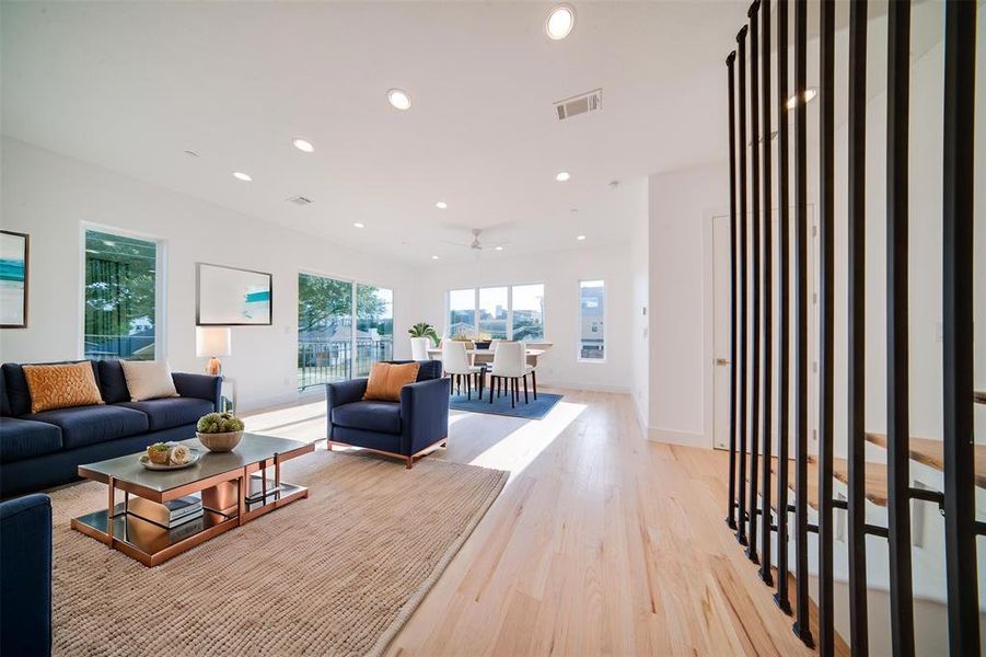 Living room with light hardwood / wood-style flooring