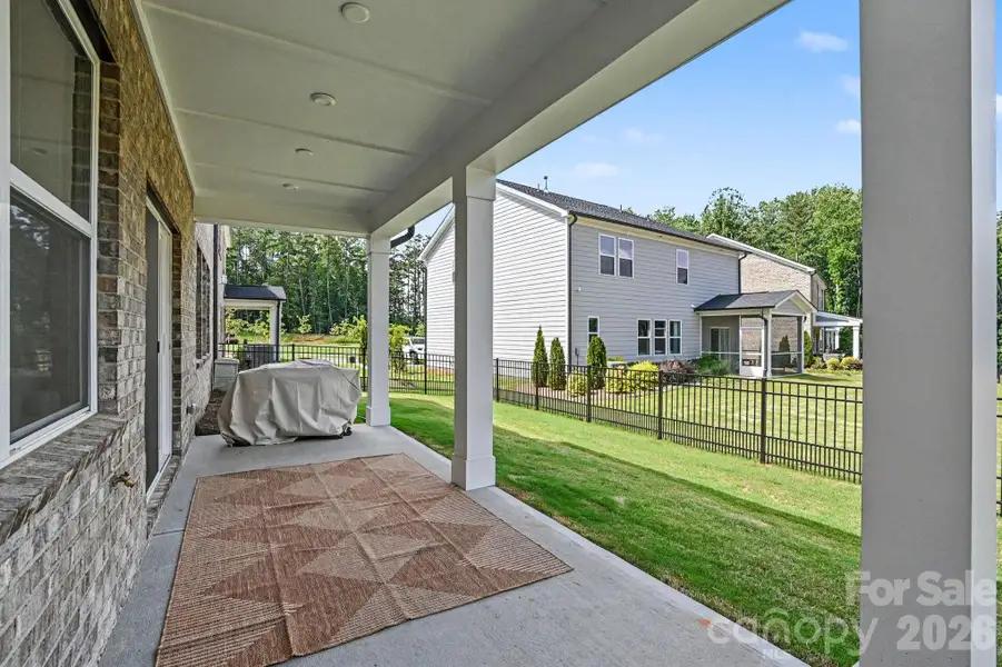 Covered patio w/ fenced yard. Upgraded covered porch extension added. Covered patio w/ fenced yard. Upgraded covered porch extension added.