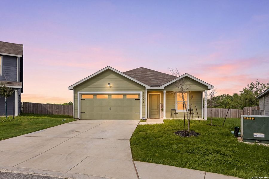 Front exterior of a new home in Mission del Lago, San Antonio, TX, highlighting curb appeal (Image 23).