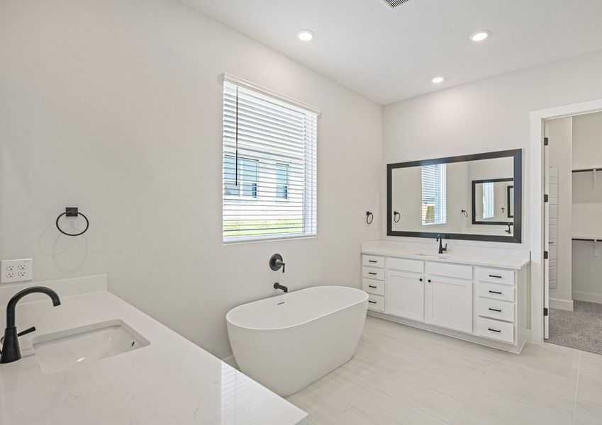 The vanities each have sprawling quartz countertops. The vanities each have sprawling quartz countertops.