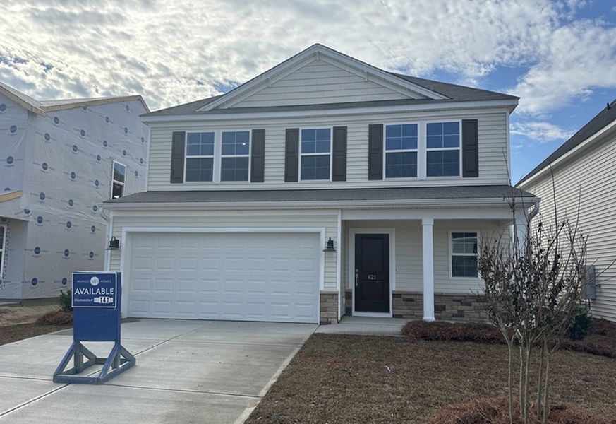 Front exterior of a new home in Winston Point, Gilbert, SC, highlighting curb appeal (Image 1).