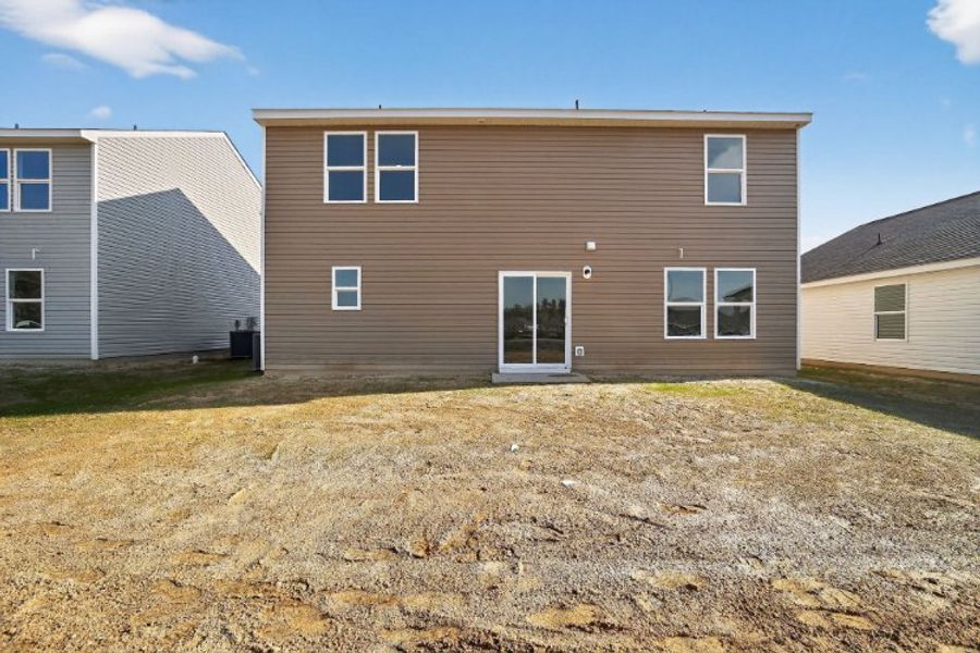 A brown building with a white door.